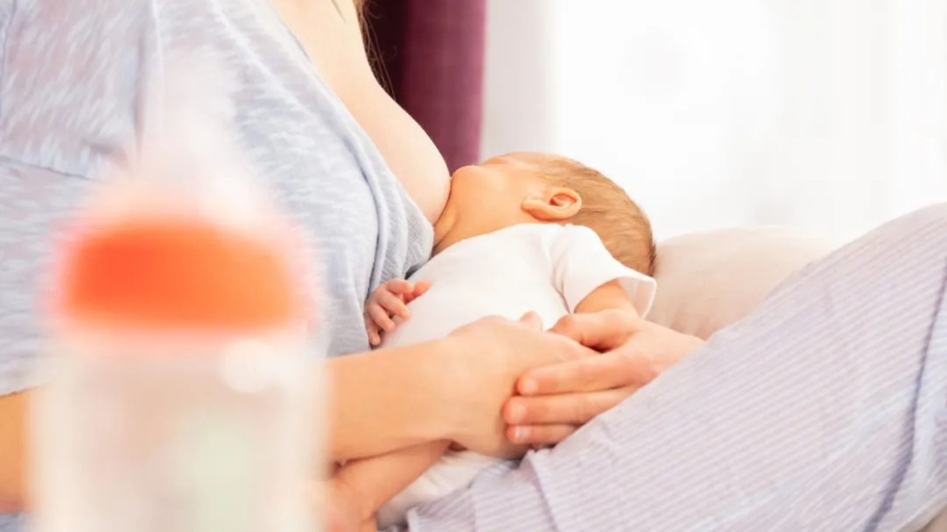 A Woman Breastfeeding her baby 